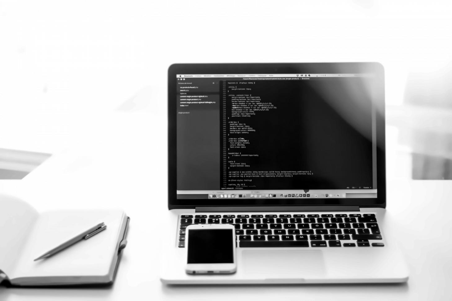 Modern office workspace showing collaborative software development environment